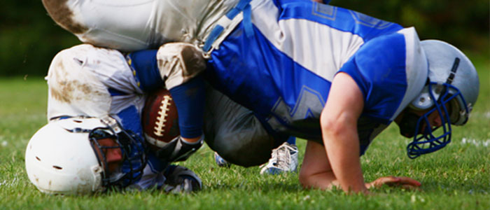 a football player getting tackled